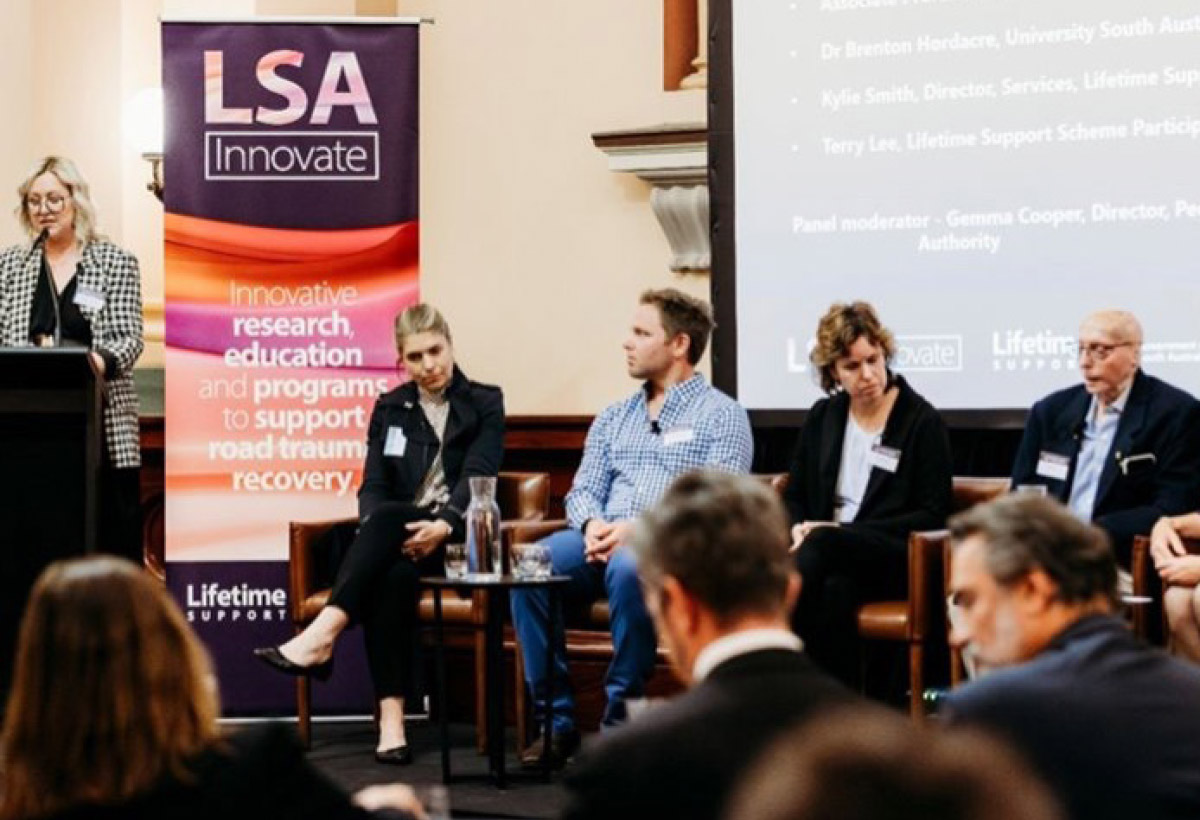 LSA Innovate Forum: speaker presenting to a panel on stage and to the audience